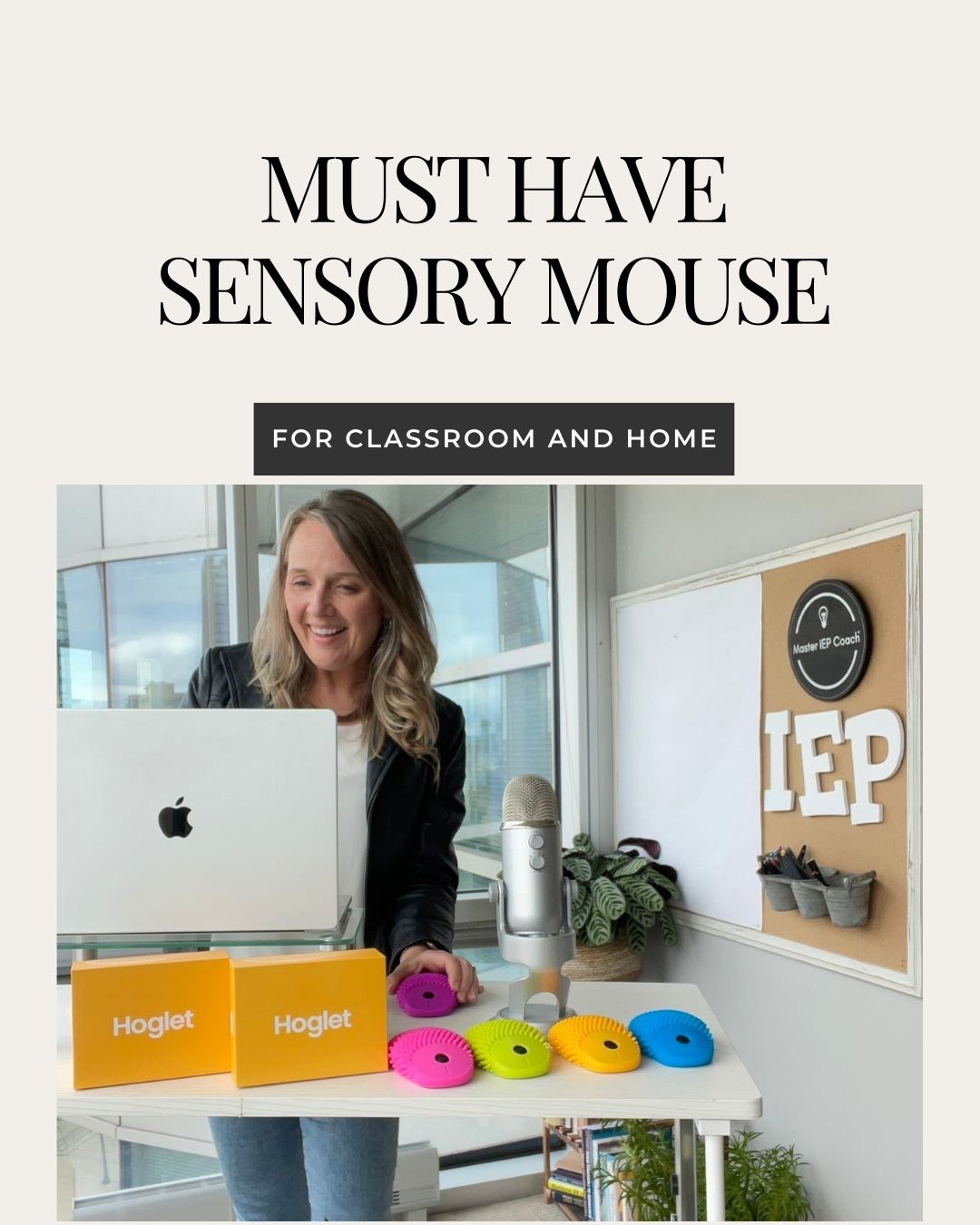 Catherine Kahl founder of Master IEP Coach standing at desk with computer sensory mouse call the Hoglet in pink, green, orange, and blue